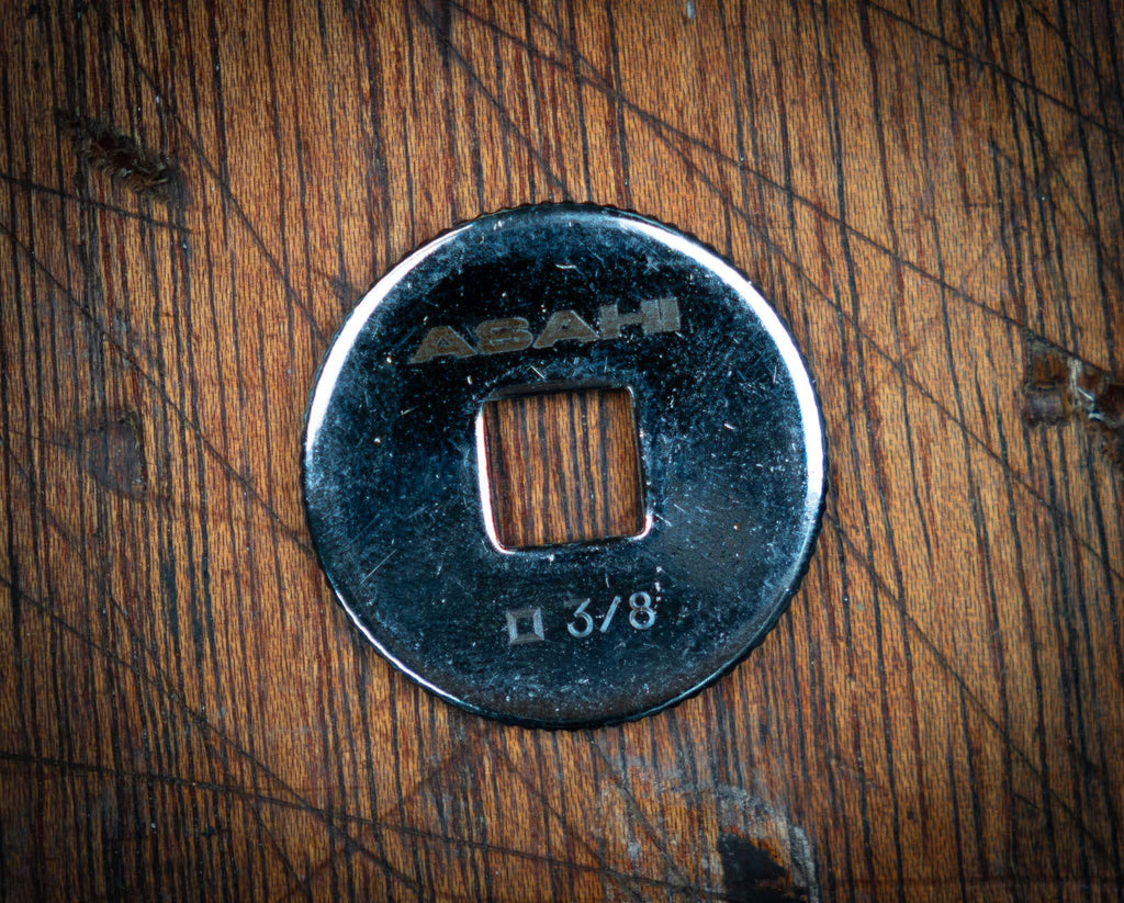 Asahi 3/8” Ratchet Spinner Disk on Wooden Surface