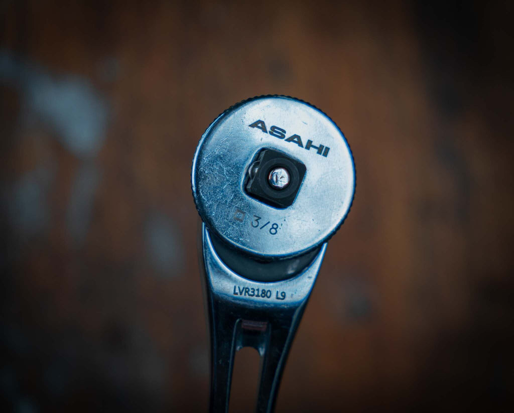 Close-up view of Asahi 3/8" Ratchet Spinner Disk showing brand name and size.